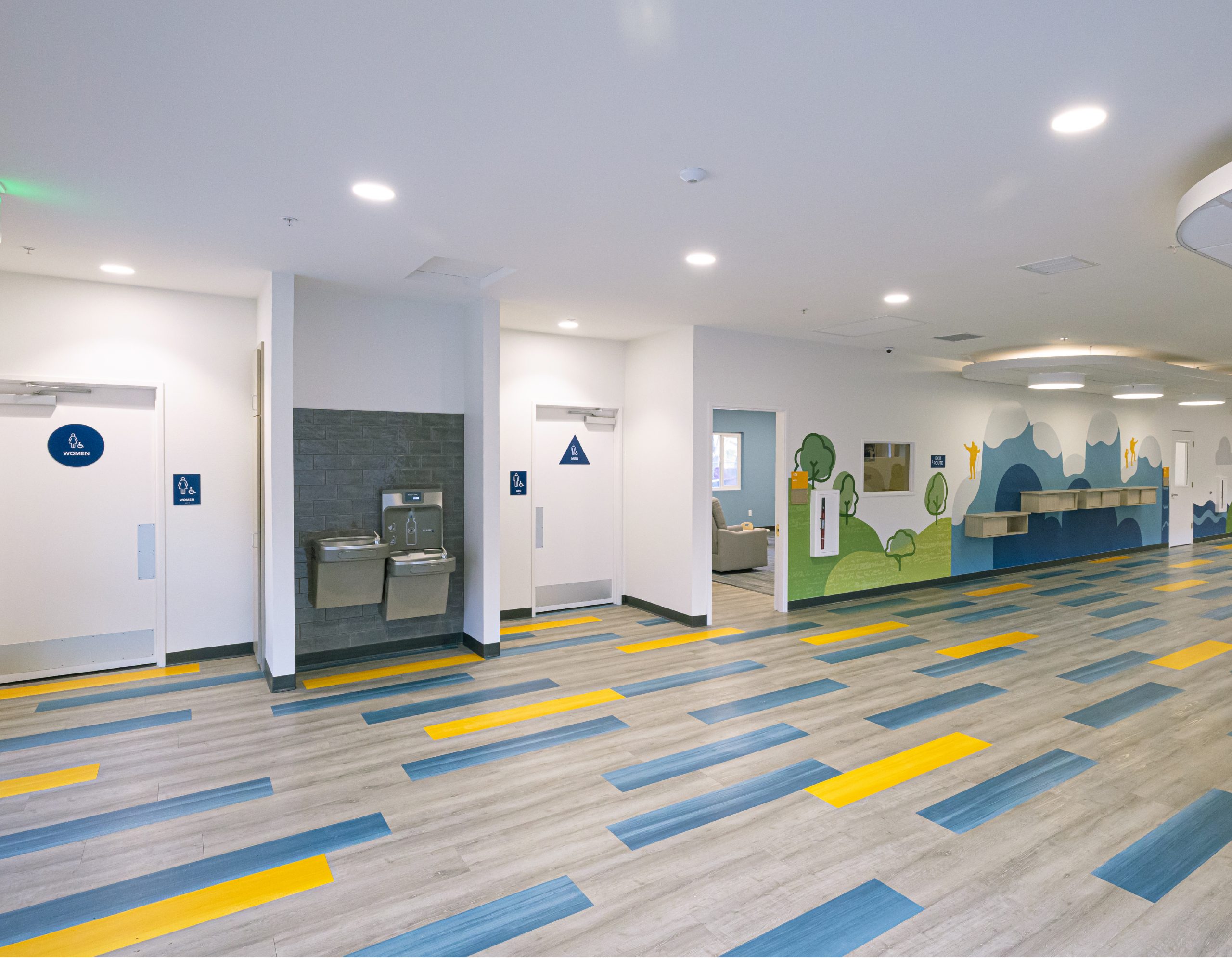 Interior wayfinding signage and environmental graphic design mural in a hallway at Evangelical Free Church of Chico by Enviropop