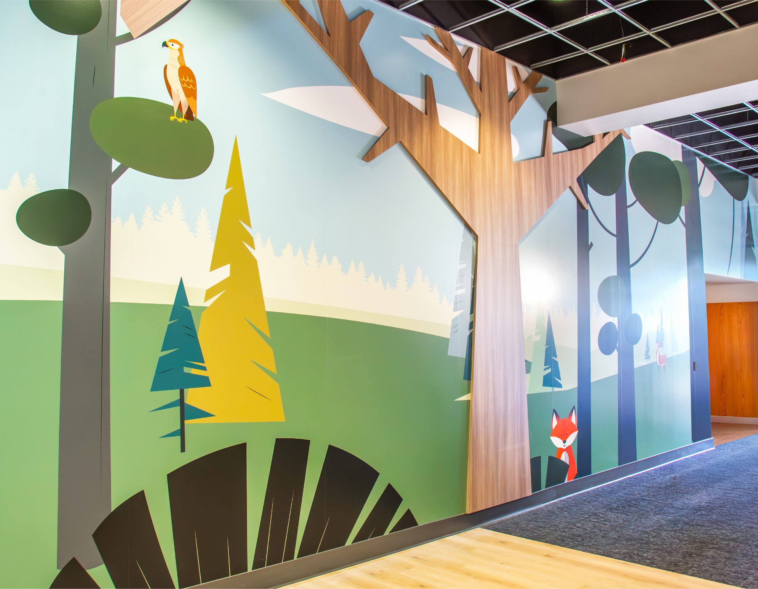 Dimensional tree wall feature and woodland character mural at Northwoods Kids, an Enviropop branded environment design